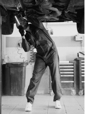 Metal Fabricator working with grinder